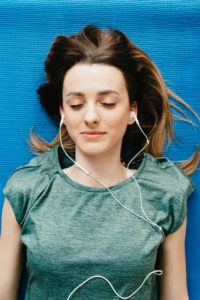 Girl listening to headphones with eyes closed